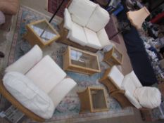 A wicker and upholstered conservatory suite comprising a two seater settee, two armchairs,