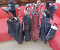 Four sets of golf clubs including Ping and Donnay together with a golf ball collector etc