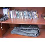 A pair of leather motorcycle trousers together with assorted CD's etc
