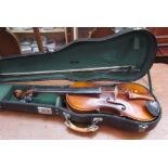 A violin and bow, bears a label, imported by Leslie Sheppard, cased, 59cm long overall,