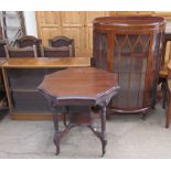 A 20th century oak bookcase with sliding glass doors together with an occasional table and a walnut