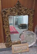 A gilt wall mirror together with an electroplated salver and a bronze letter box and a brass violin