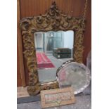 A gilt wall mirror together with an electroplated salver and a bronze letter box and a brass violin