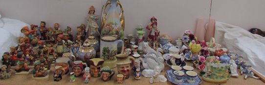 Numerous Hummel figures together with continental figures, twin handled vases,