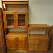 A modern pine side cabinet together with a matching bookcase