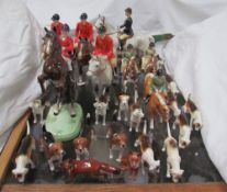 Beswick - a pair of Huntsman on bay horses together with another huntsman on a rearing horse,