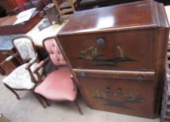 A 20th century chinoiserie decorated cocktail cabinet, with a hinged lid and mirrored interior,