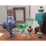 A Tiffany style table lamp together with another table lamp,