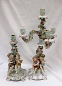 A Meissen style candleabra with three branches encrusted with flowerheads and leaves,