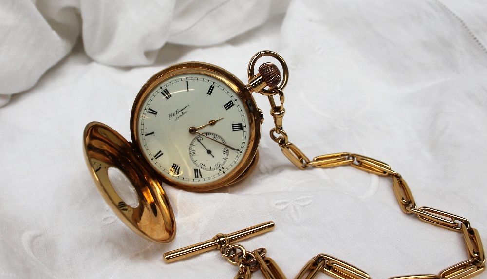 An 18ct yellow gold half hunter keyless wound pocket watch,