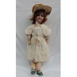 An SFBJ French bisque head doll, with fixed eyes, open mouth and teeth, to a composition body,