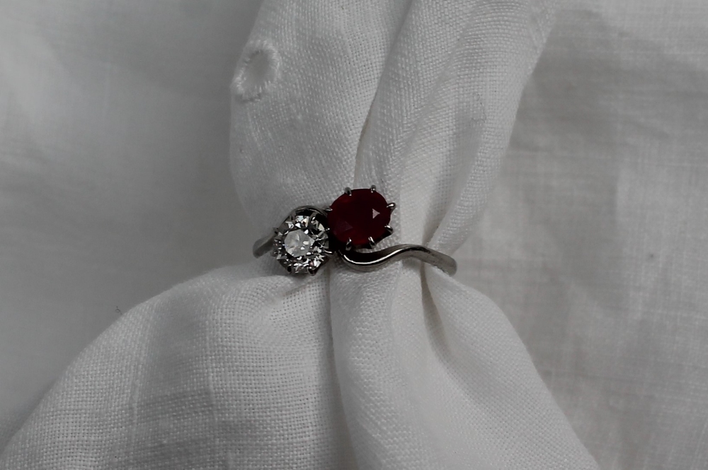 A ruby and diamond crossover ring, the round old cut diamond approximately 0. - Image 2 of 4