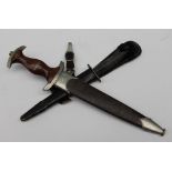 A German Third Reich SA Dress Dagger, with a hardwood grip, inset with SA emblem and eagle,