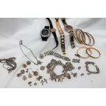 A Lady's Accurist wristwatch together with other wristwatches, bangles, silver charm bracelet,