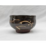 A Winchcombe pottery bowl, decorated in browns and cream, impressed mark,