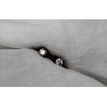 A pair of diamond stud earrings, set with round brilliant cut diamonds each approximately 0.