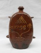 An 18th century slipware flask, of rectangular form,