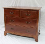 An Edwardian mahogany chest,