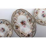 A pair of Nantgarw porcelain plates and a matching oval dish,