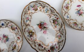 A pair of Nantgarw porcelain plates and a matching oval dish,