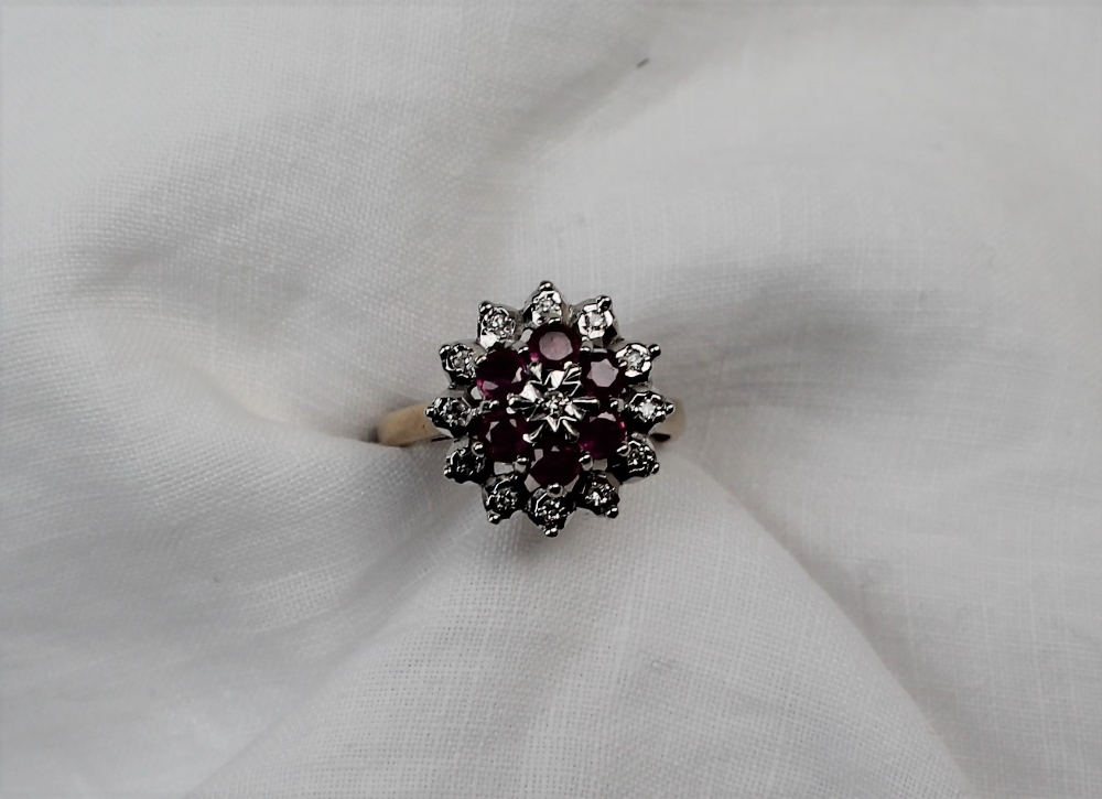 A ruby and diamond cluster ring set with thirteen round brilliant cut diamonds and six round - Image 5 of 6