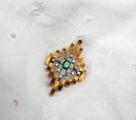 An 18ct yellow gold emerald and diamond pendant / brooch,