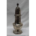 A late Victorian silver sugar caster, with a flame finial,