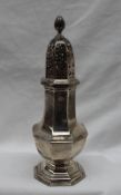 A late Victorian silver sugar caster, with a flame finial,