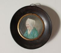 19th century British School Head and shoulders portrait of a lady A circular miniature on