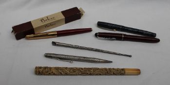 A sterling silver propelling pencil, with line decoration, together with a silver quill,