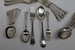 A George V silver part flatware service comprising six table spoons, six dessert spoons,