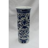 A Chinese porcelain cylindrical vase decorated with butterflies and birds amongst flowerheads and