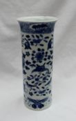 A Chinese porcelain cylindrical vase decorated with butterflies and birds amongst flowerheads and