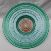 A Shelley pottery charger, with a spiralling green and blue sprayed pattern, printed mark, No.
