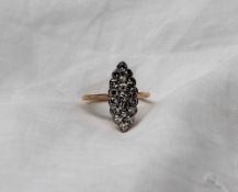 An Edwardian diamond cluster ring of pointed oval form,