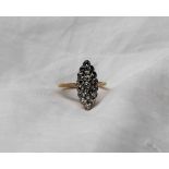 An Edwardian diamond cluster ring of pointed oval form,