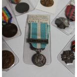 A French colonial medal for active service in the colonies, with "Extreme Orient" clasp,