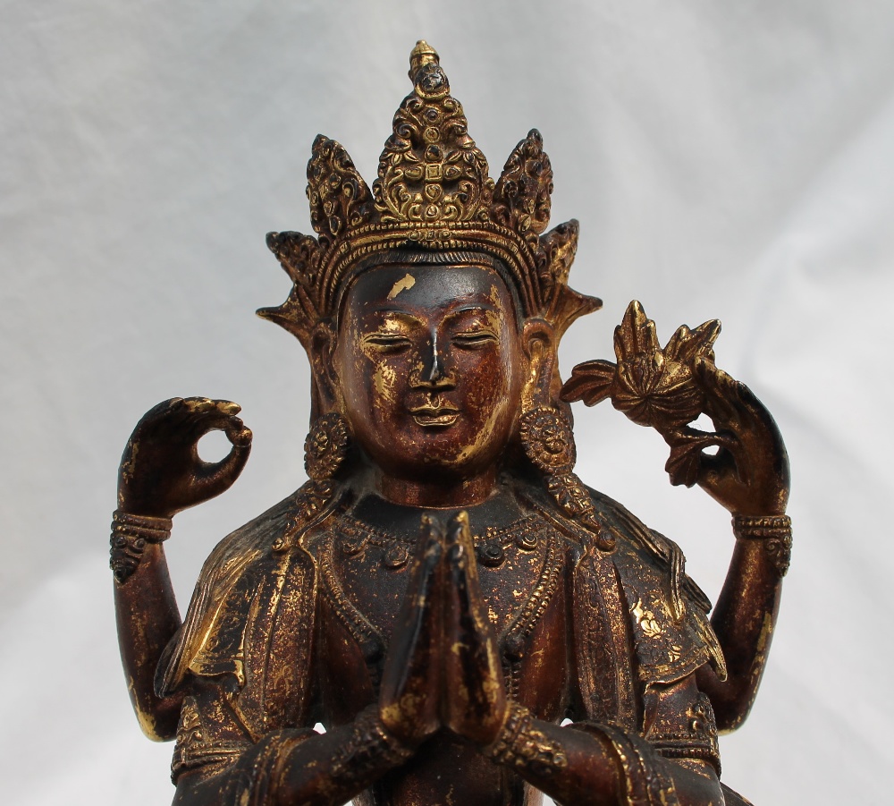 An oriental gilt bronze statue of Lakshmi seated on a leaf and bead decorated base, 25cm high x 15. - Bild 7 aus 7
