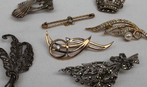 An aquamarine and seed pearl bar brooch together with two paste set brooches and marcasite set