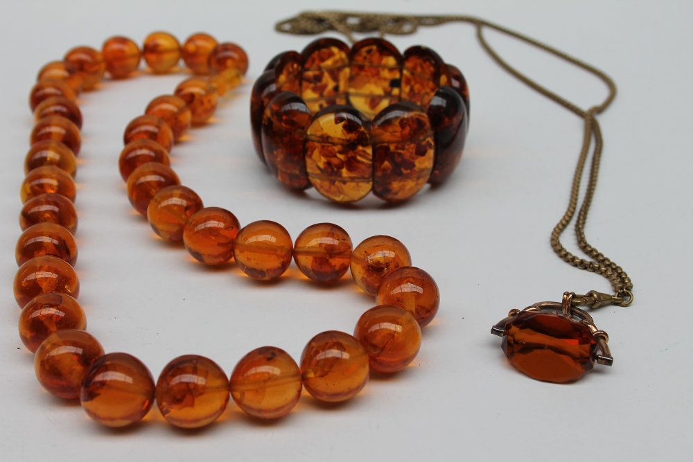 An amber bead necklace with spherical beads together with an expanding bracelet a rotating fob seal - Image 3 of 7