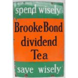 An enamel sign with bands of green and orange "Spend Wisely, Brooke Bond dividend Tea, Save Wisely",