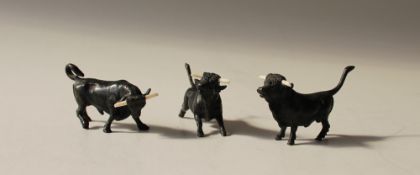 Three small bronze models of bulls, 6.
