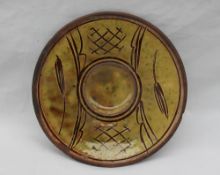 A Michael Cardew Winchcombe pottery saucer dish,