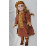 An SFBJ bisque head doll, with fixed blue eyes, pierced ears and open mouth and teeth,