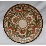 A Crown Ducal, Charlotte Rhead pottery charger decorated with orange,