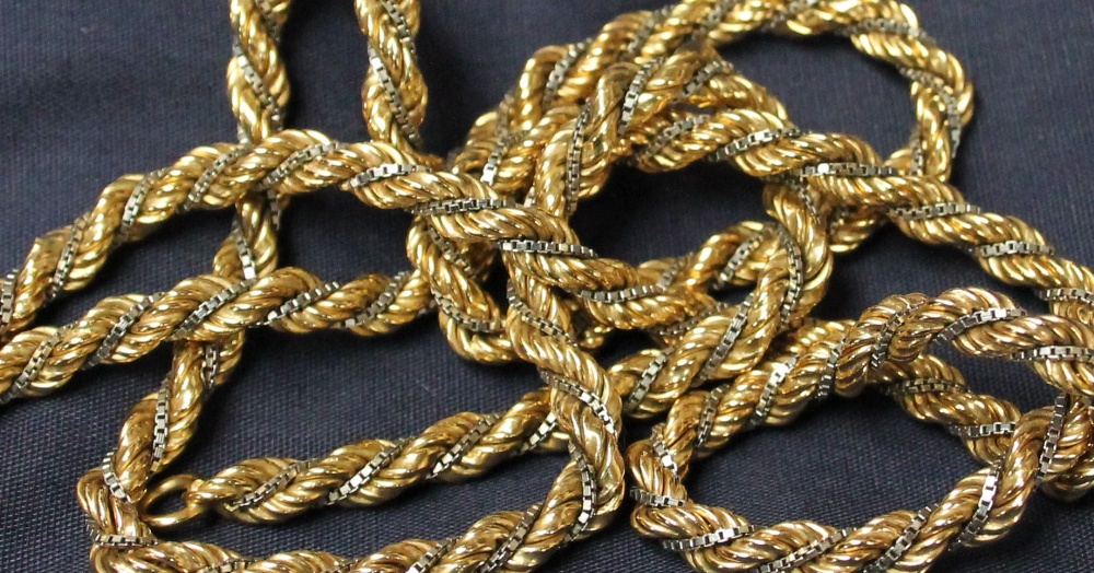 An 18ct yellow and white gold rope and box link twist necklace, 73cm long, approximately 41.