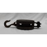 An oak and iron pulley, of oval form with a cast iron hook,