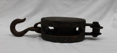 An oak and iron pulley, of oval form with a cast iron hook,