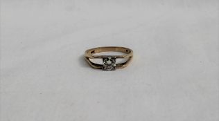 A solitaire diamond ring the round old cut stone approximately 0.