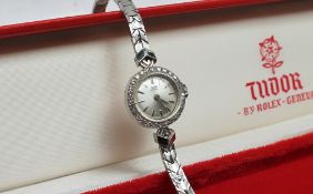 A Lady's 9ct white gold Tudor by Rolex wristwatch, the silvered dial with batons,